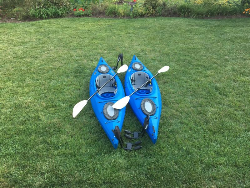 2 Kayaks by Equinox, lifejackets and carriers