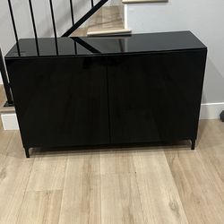 IKEA black storage  cabinet mirror in the top black doors