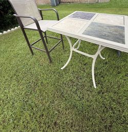 PATIO TABLE with one barstool.( free perennial plant)