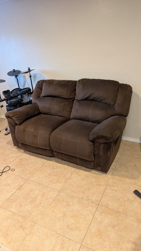 Ashley Furniture Quinnlyn - Coffee Reclining Loveseat with Reversible Couch Cover.