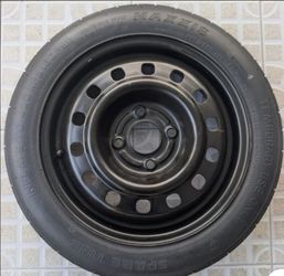 Donut Spare Tire on Steel Wheel 4 lug