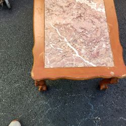 a marble-top occasional or cocktail table. 