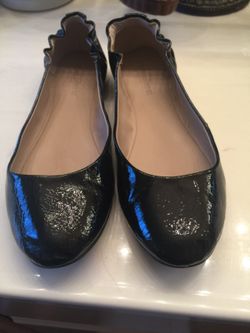 Ladies size 8 1/2 black patten flats .