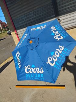 Royal blue Coors Seltzer promotional patio market umbrella