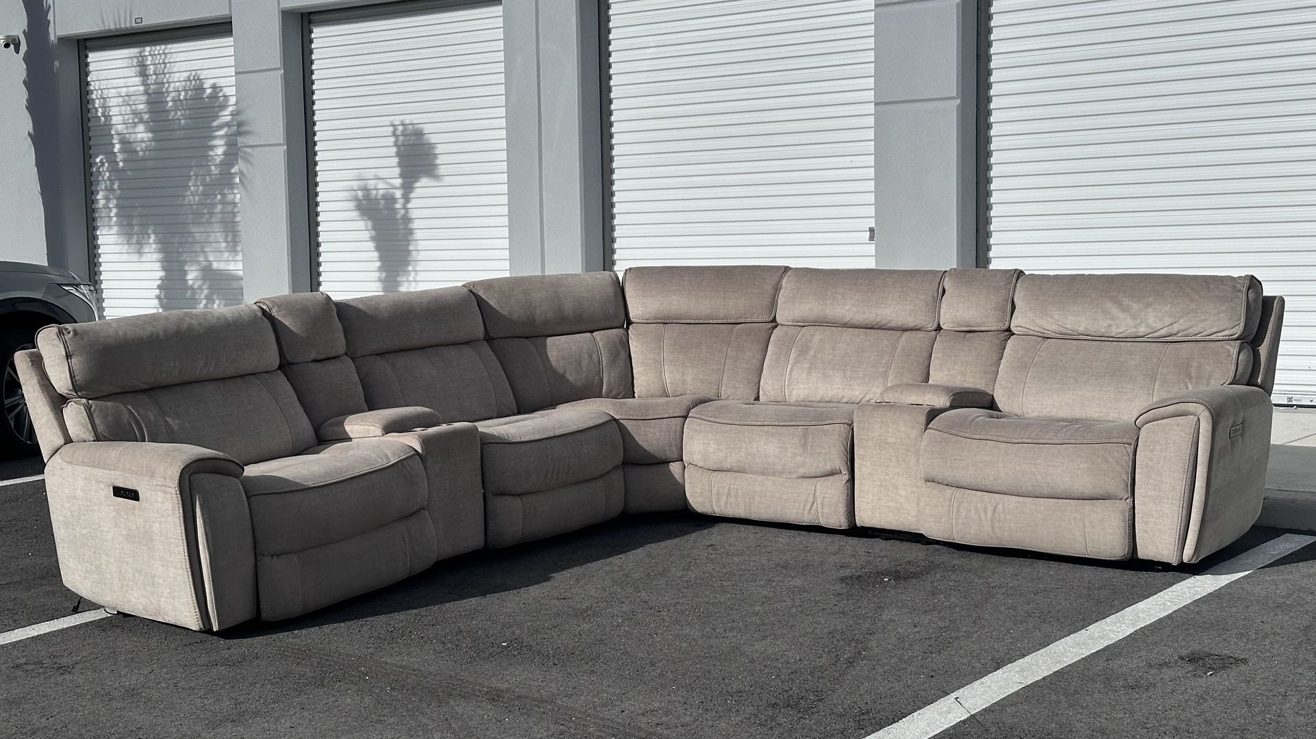 GRAY MODULAR SECTIONAL SOFA w 4 RECLINERS AND USB CHARGER by CITY FURNITURE - delivery is negotiable