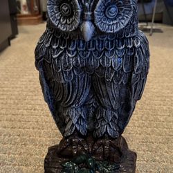 Owl Statue Sitting On A Branch