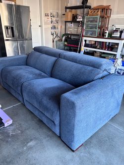 Nevio 2-Pc. Fabric Power Headrestuu Sectional with 2 Power Motion Chairs.
