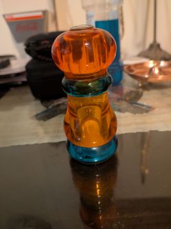 Olde Thompson Sunset Fiesta salt shaker or pepper mill made of multi-colored acrylic or lucite.The design features a stacked, retro 1970s or 1980s aes