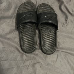 All black nike slides