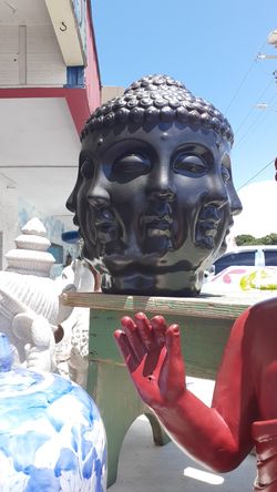 Cool multi face Buddha head statue