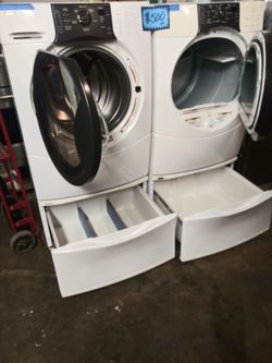 Kenmore front load washer and dryer set with pedestals in excellent conditions