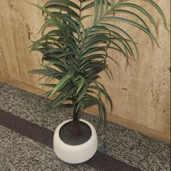 artificial palm plant in a white pot, l