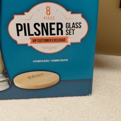  New never used in box- Pilsner glass 4 set with 4 coasters  9 inches tall $10.00