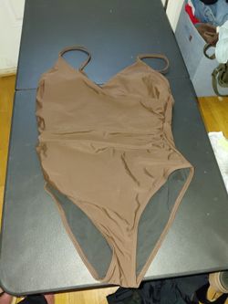 New 1 piece bathing suit M/L