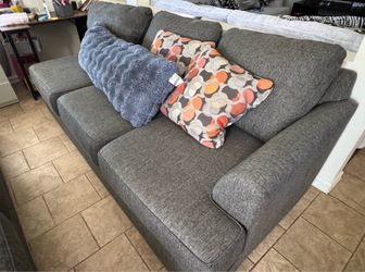 Gray sectional sofas with pillows