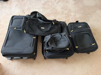 Never used Black Luggage Set with Duffle and Tote Bags