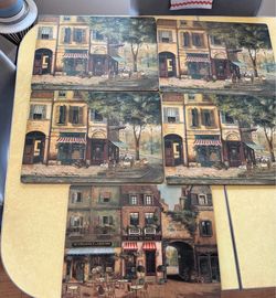 Five place mats. Paris themed. Beautiful scenes cork back.