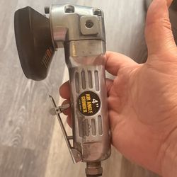 pneumatic die grinder or cut-off tool used for grinding, cutting, and polishing metal or other materials.