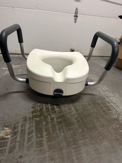 Raised toilet seat