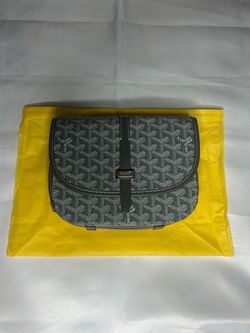 Grey brand‑style sidebag with patterned design and adjustable strap.