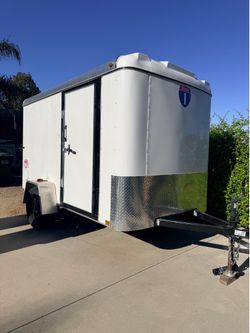 Trailer, tables, chairs, umbrellas, canopies