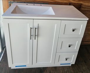 WHITE BATHROOM VANITY CABINET WITH CULTURED MARBLE TOP....36 INCHES WIDE....NEW....$ 300