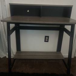 black and wooden desk/table