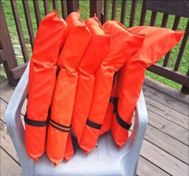 5 Orange Life Jackets