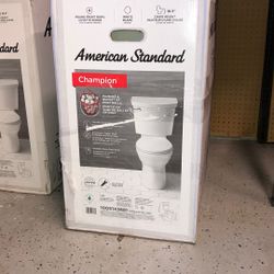 American Standard Champion Two-Piece 1.28 GPF Single Flush Round Chair Height Toilet with Slow-Close Seat in White