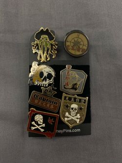 Disney Pirates of the Caribbean Skull Pirate Pin Lot 7 Pins On Backing Card