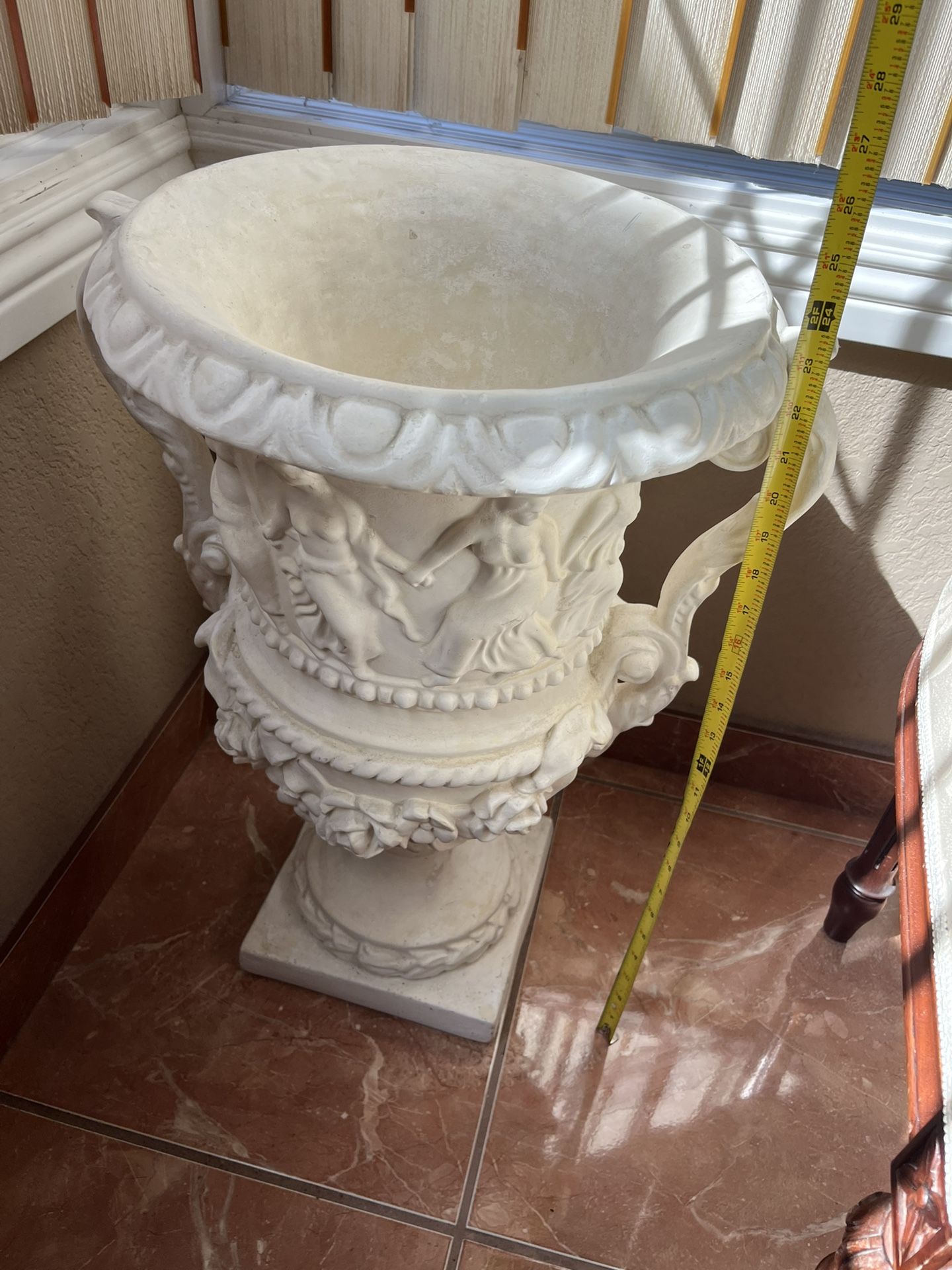 Very nice decorative plant/flower planter. 2 feet tall.