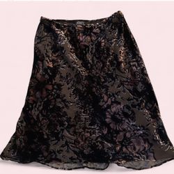 Adrianna Papell skirt featuring a black and pink floral burnout velvet pattern. It is likely a midi or A-line style, potentially made of a silk or pol