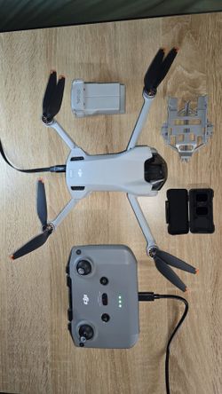 DJI Mini 3 with 3 batteries, case, controller, nd filters, and landing gear.