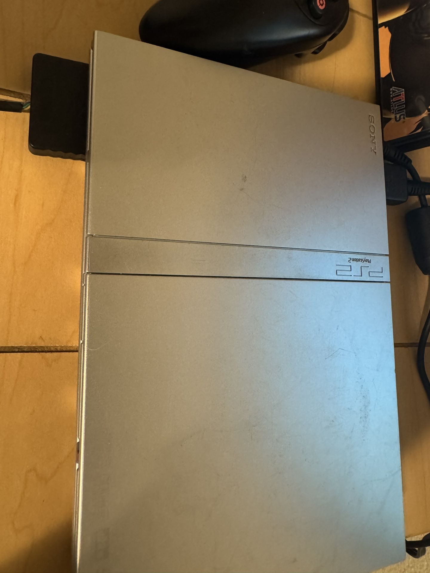 Working Silver PlayStation Slim