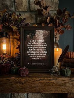 Framed print in the image features the biblical passage 1 Corinthians 10:13