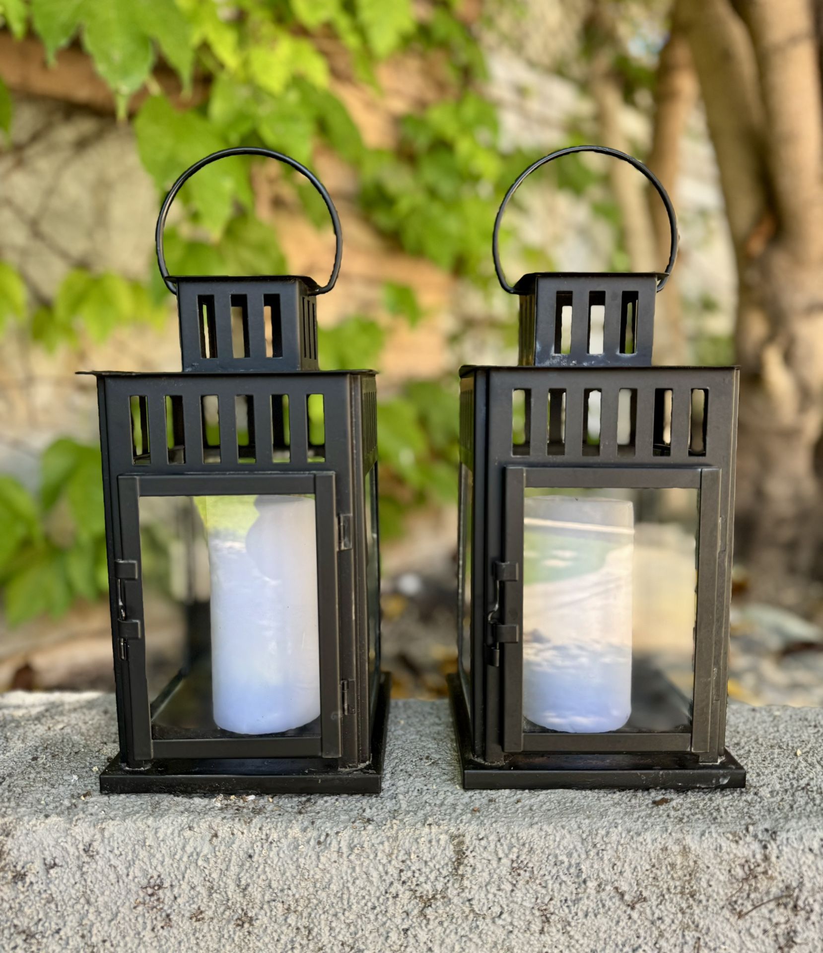 A pair of Black Metal Outdoor Lantern. 11” H x 6” W x 6” W. $20 for both. Price is firm.
