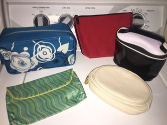 Makeup bags. All brand names such as Lancôme, Estée Lauder, Clinique, & more