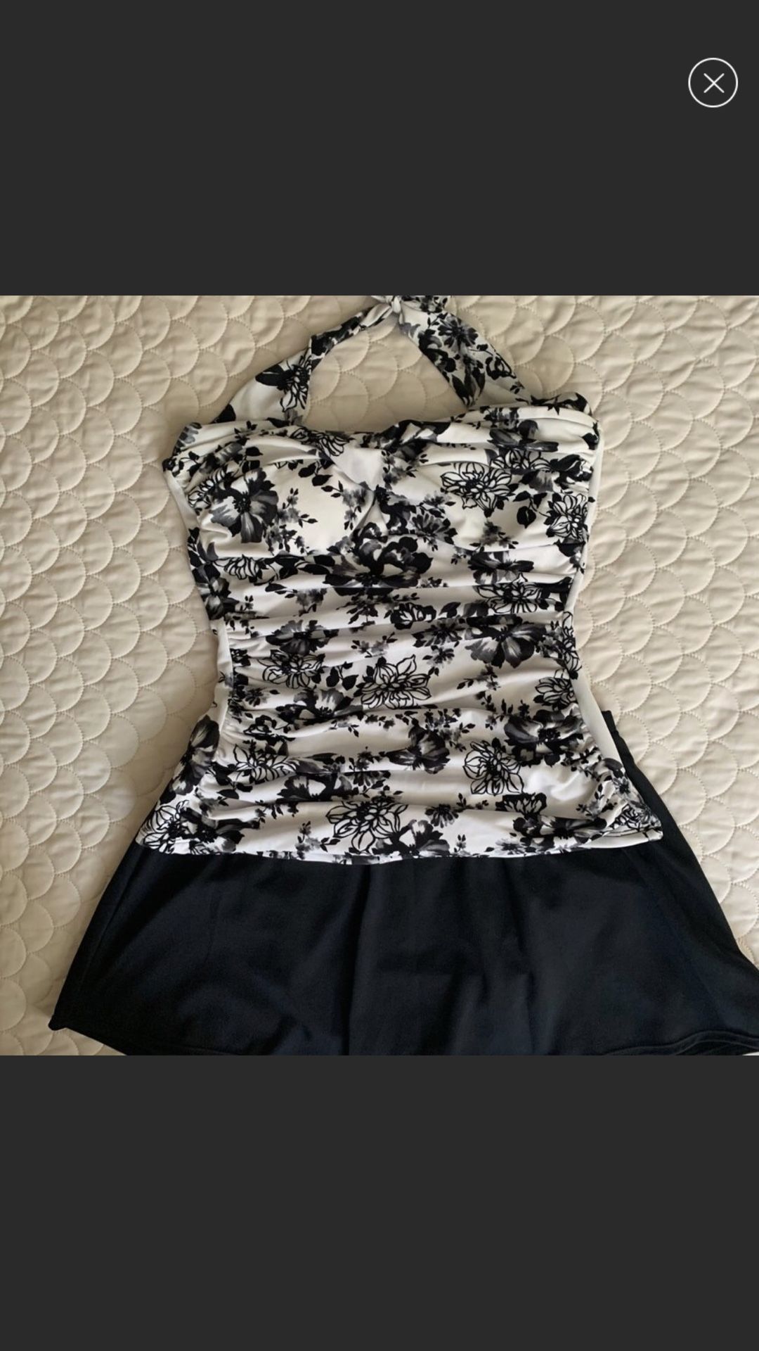Two piece suit flowery white with black flowers very flattering by Catalina namebrand suddenly slim size medium New Like Condition