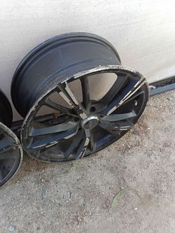 Black Alloy Wheel Rim with Curb Damage