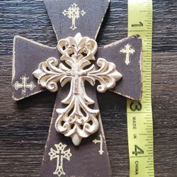 Brown Cross, distressed finish with a raised, ornate cream-colored cross on top.
