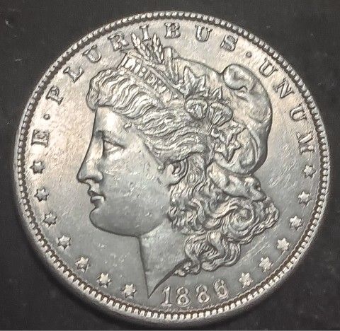 1886 MORGAN SILVER DOLLAR AU