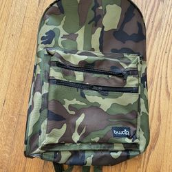 This is a camouflage backpack with a dual shoulder strap. • Design: It features the classic Woodland camouflage pattern, consisting of green, brown, b
