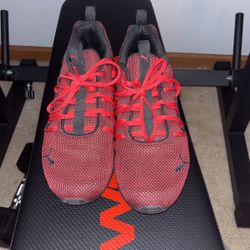 Red And Black puma running shoes size 7.5 US