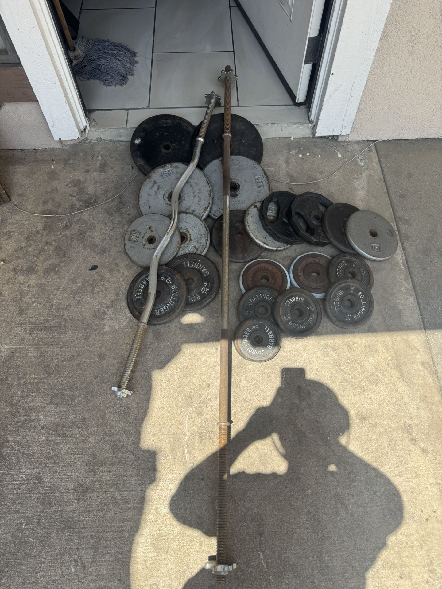 Standard weights 236lbs total plus curl bar and straight bar