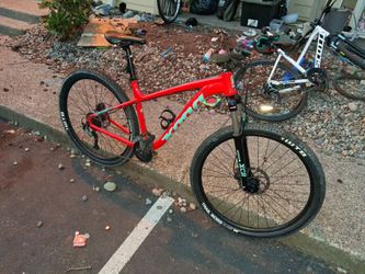 Kona  29 inch mountain bike with big trail boss tires and a larger frame