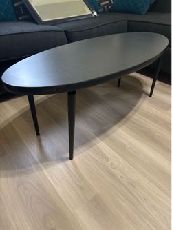 Oval shape, black table