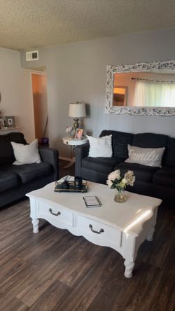 Sofas , coffee table , side table with lamp and shelf