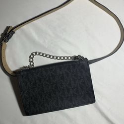Michael Kors MK Signature Logo Pull Chain belt bag in black faux leather with silver-toned hardware