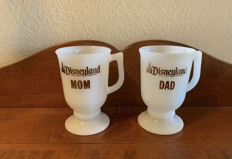 Pair of vintage milk glass footed Disneyland Mom & Dad Mugs - just under 5.25” tall