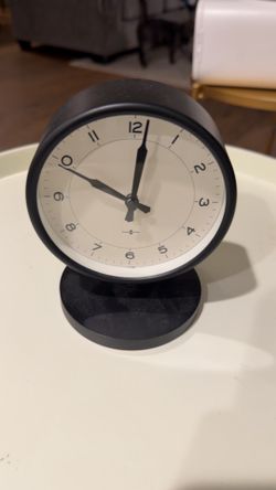 Round Side Table + Modern Black Clock
